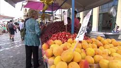 People Shopping At Market Stall News Clip