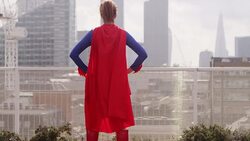 Superhero viewing city from rooftop Stock Footage