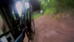 A cyclist pedals his bike down a mountain path. Stock Footage