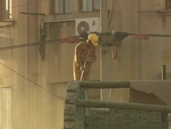 WS View of worker demolishing house disturbing by dust around him / Shanghai, China Stock Footage