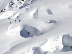 Skiers Move Across Alaskan Glacier Stock Footage