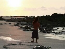 MS Rasta man spinning on beach with poi balls  / Montezuma, Punteranes, Costa Rica Stock Footage
