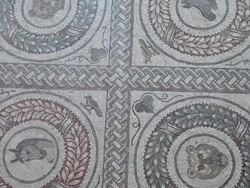Piazza Armerina (villa Romana del Casale), quadrangular peristyle, mosaic with medallions with figures and flowers Stock Footage