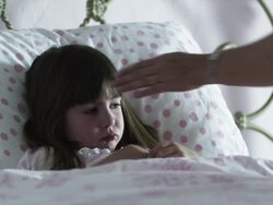 MS Girl (2-3) lying in bed, receiving syrup on spoon, American Fork, Utah, USA Stock Footage