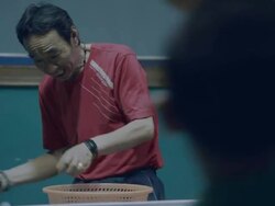 Chinese boy and coach playing ping pong Stock Footage