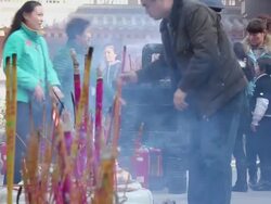 MS People burning incense in temple during chinese new year/xian,shaanxi,china Stock Footage