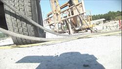 High pressure water hoses lead to a granite cutting machine. Stock Footage