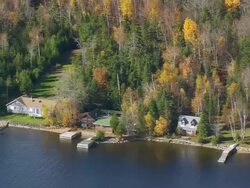WS ARIEAL View of Houses on Moosehead lake bank / Maine, United States Stock Footage