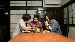 Three young women preparing food in the kitchen Stock Footage