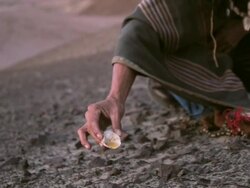 CU TS Shot of mam showing Native ritual AUDIO / South Of Peru, Nazca, Peru Stock Footage
