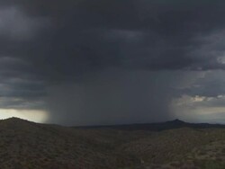 T/L very heavy rain shower and lightning bolt over mountains. Sonoran Desert near Tucson, Arizona, USA Stock Footage