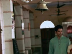 Couple ringing bell of a temple  Stock Footage
