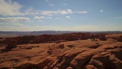 Rising aerial shot above The Elephant Arch at The Arches National Park Stock Footage