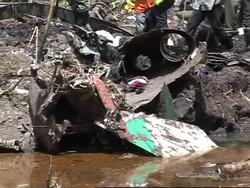 Rescue workers and villagers work at crash site News Clip