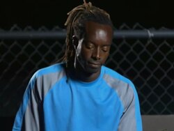 MS, TU, Male tennis player sitting on bench at tennis court and bouncing ball, night, Santa Barbara, California, USA Stock Footage