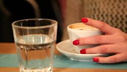 Girl drinks Morning coffee - hands , fingers , cup close-up Stock Footage
