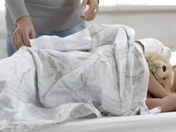 HD DOLLY: Mother Taking Care Of Her Sick Son Stock Footage