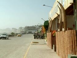 WS View of Beach front street of Pimentel, restaurant with traditional reed boats / Pimentel, Lambayeque, Peru Stock Footage