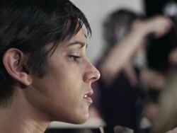 CU PAN R/F Female makeup artist and hair stylist backstage at fashion show Stock Footage