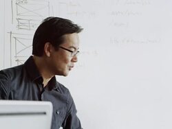 MS designer in high tech office discussing project Stock Footage