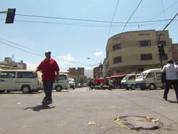 Junction with lots of small vans, La Cancha market & people, Cochabamba, Bolivia Stock Footage