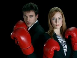 HD SLOW MOTION: Business Partners Punching At The Camera Stock Footage