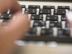 Hand typing a laptop computer Stock Footage