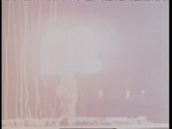 An atomic bomb explodes in the desert during military testing. News Clip