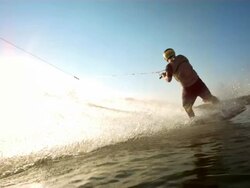 HD Super Slow-Mo: Wakeboarder Jumping Over The Wake Stock Footage