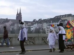 MS Shot of Basel Carnival (Basler Fasnacht) with people moving on bridge / Basel, Switzerland Stock Footage