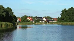 Small village by lake, roof with solar energy Stock Footage