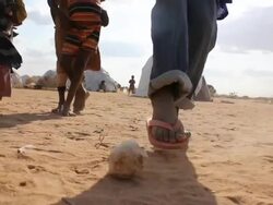 Kids playing with cloth ball in refugee camp Stock Footage