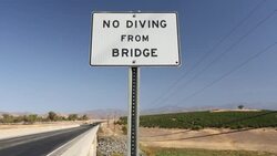 Lake Success near Porterville, Bakersfield with a no diving sign over an empty arm of the reservoir which is at 7% capacity. Bakersfield is now the driest city in the USA. Most of California is in exceptional drought, the highest level of drought classific Stock Footage