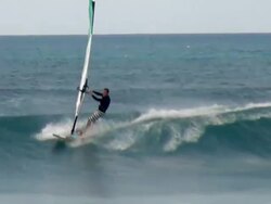 WS TS View of Wind sail surfing on big waves at beach near Santa Maria / Santa Maria, Sal, Cape Verde Stock Footage