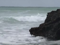 MS Wave breaking on rock in ocean / Aniston, Western Cape, South Africa Stock Footage