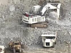MS AERIAL Shot of dump truck being filled with rubble on opencast mine / Johannesburg, Gauteng, South Africa Stock Footage