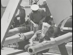 1941: US NAVY ASIATIC FLEET: US Navy sailors cleaning ship's cannon barrels, filing, scrubbing, cleaning in torpedo room, sailor using paint brush on torpedo, another sailor turning torpedo propellers w/ tool.  WWII, pre-Pearl Harbor. Instructional Video