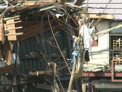 Damage in port area of Kesennuma City, Japan filmed on 1 April 2011, 3 weeks after a tsunami which was caused by magnitude 9 Tohoku earthquake off north east Japan / AUDIO Stock Footage