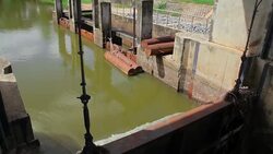 Flowing water at floodgate,Tilt Down Stock Footage