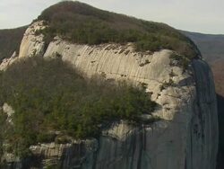 MS Shot of tree covered Stool Mountain and Table Rock mountain / South Carolina, United States Stock Footage