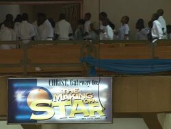 MS Shot of congregations leaving church with sign on wall CHRIST, Gateway to : MAKING OF STAR / Lagos, Nigeria Stock Footage