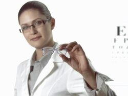 HD: Female Ophthalmologist Showing Children's Glasses Stock Footage