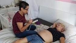 Midwife - Doppler fetal monitor Stock Footage