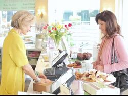 MS Customer purchasing baked goods in bakery cafe / Los Angeles, California, United States Stock Footage