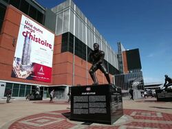 MS Shot of Jean Beliveau hockey statue and people walking and taking photos in front of Bell Centre / Montreal, Quebec, Canada Stock Footage