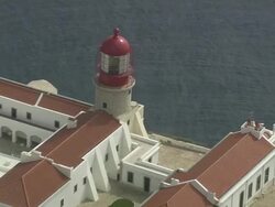 AERIAL CU ZO WS Detail of lighthouse at Cape St Vincent / Sao Vicente, Faro, Portugal Stock Footage