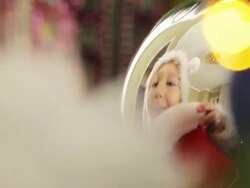 boy decorates the Christmas tree toys Stock Footage