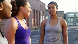MS Smiling women in discussion after run on summer morning through city streets Stock Footage