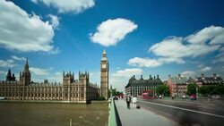Pedestrians and traffic race across the Tower Bridge in London. Stock Footage