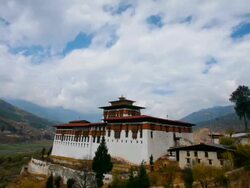 T/L, WS, ZO, clouds passing over the Paro Dzong / Paro, Bhutan Stock Footage